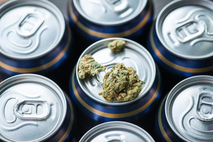 Beer cans with cannabis on one of them